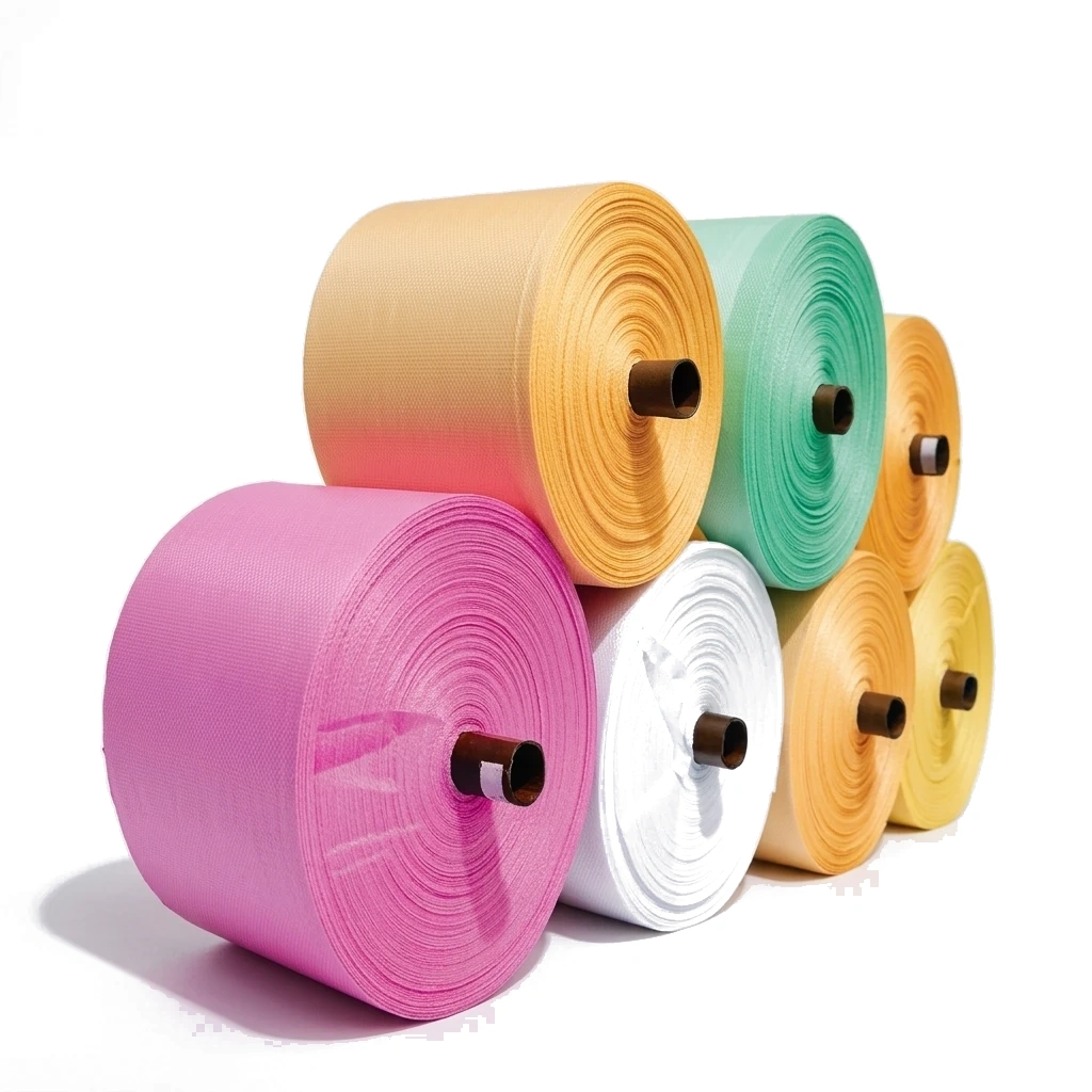 PP woven fabric rolls in vibrant colours stacked in studio